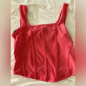 Brand new with tags.‎ Saints 21 top. Pretty pink size medium.